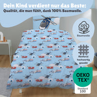Vorderseite der Kinderbettwäsche mit Polizei und Feuerwehrauto + Helikopter auf Bett gezogen