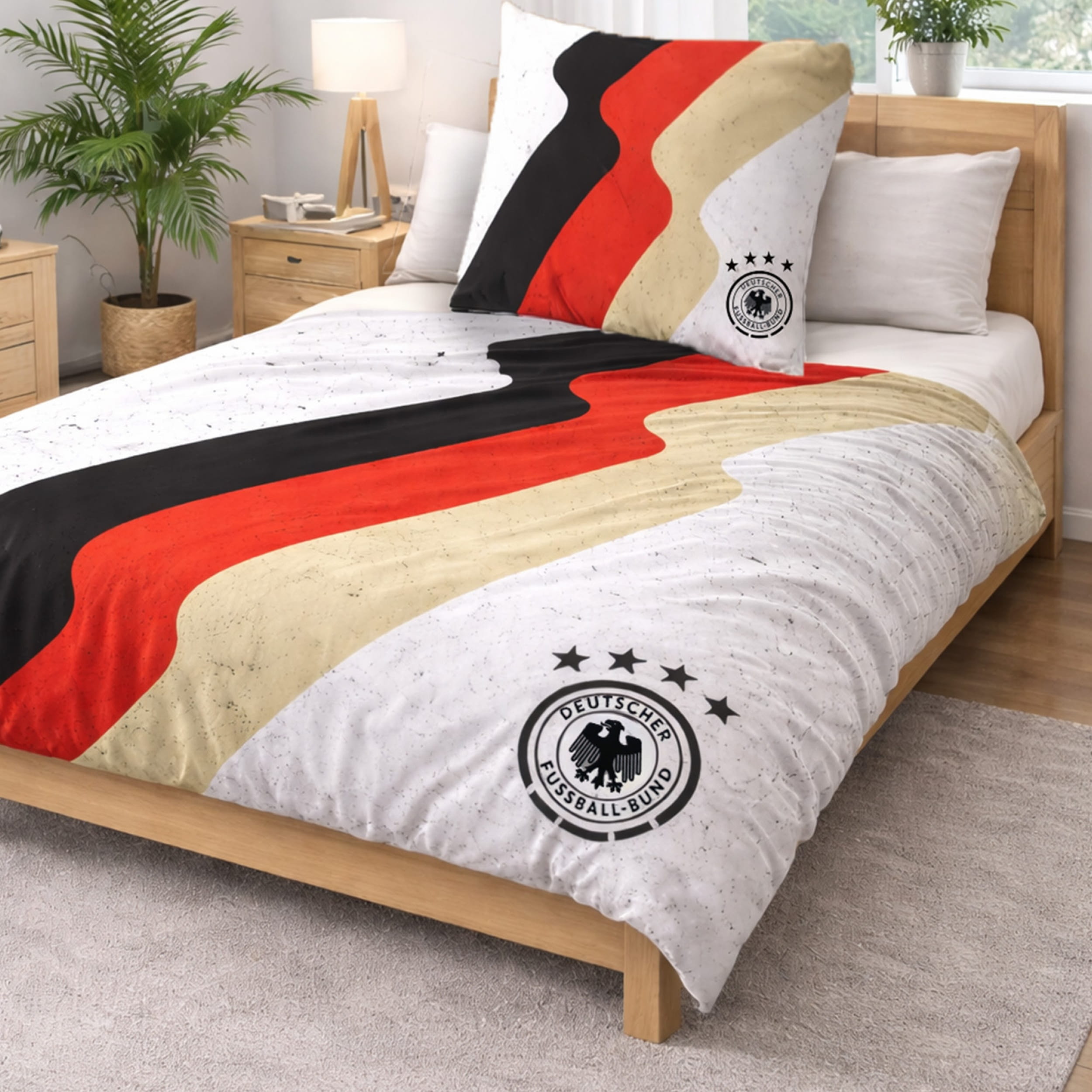 DFB Bettwäsche weiß mit Deutschlandfarben und DFB LOGO auf Bett gezogen