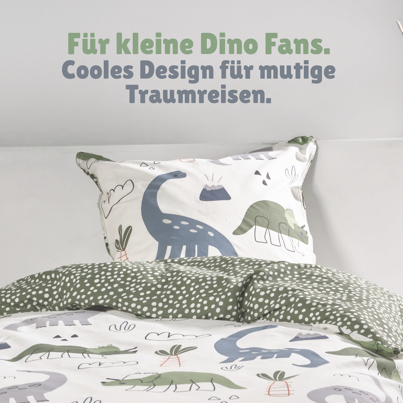 Detailansicht Kopfkissen weiß mit Dinos und Vulkanen