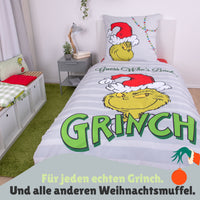 Vorderseite der Grinch Bettwäsche auf Bett gezogen