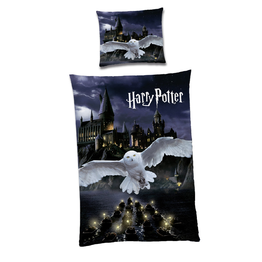 Schwarze Harry Potter Bettwäsche mit Wendemotiv Hedwig vorne und Wappen Hogwarts auf der Rückseite