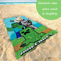 Strandtuch am Strand mit Infotafel