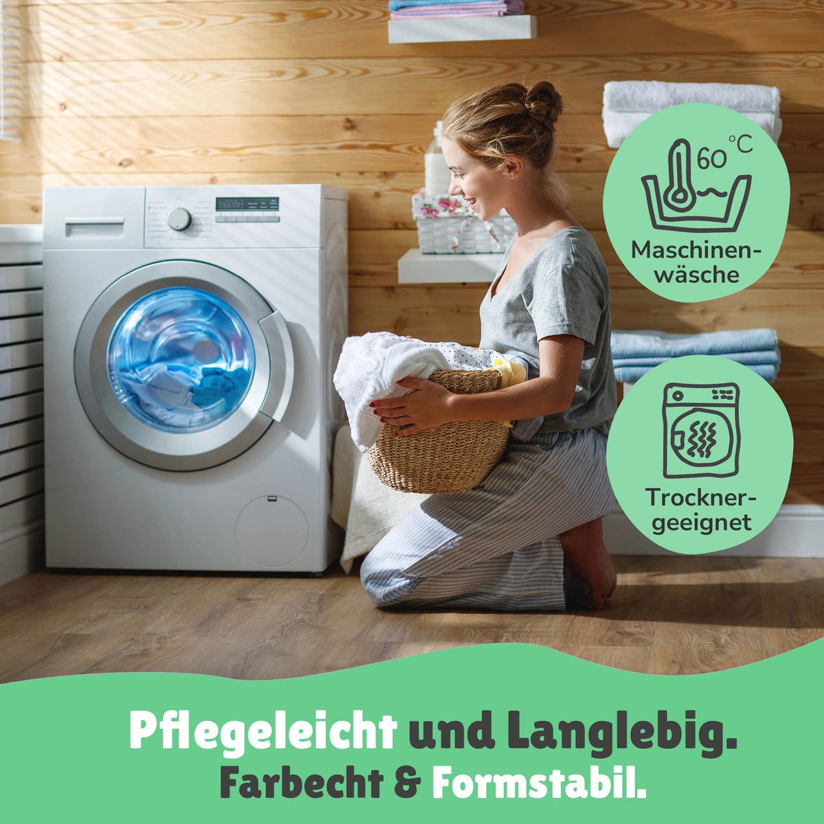 Junge Mutter ist zufrieden in der Waschküche vor der Waschmaschine; Info zur Pflege 60°C + Trocknergeeignet